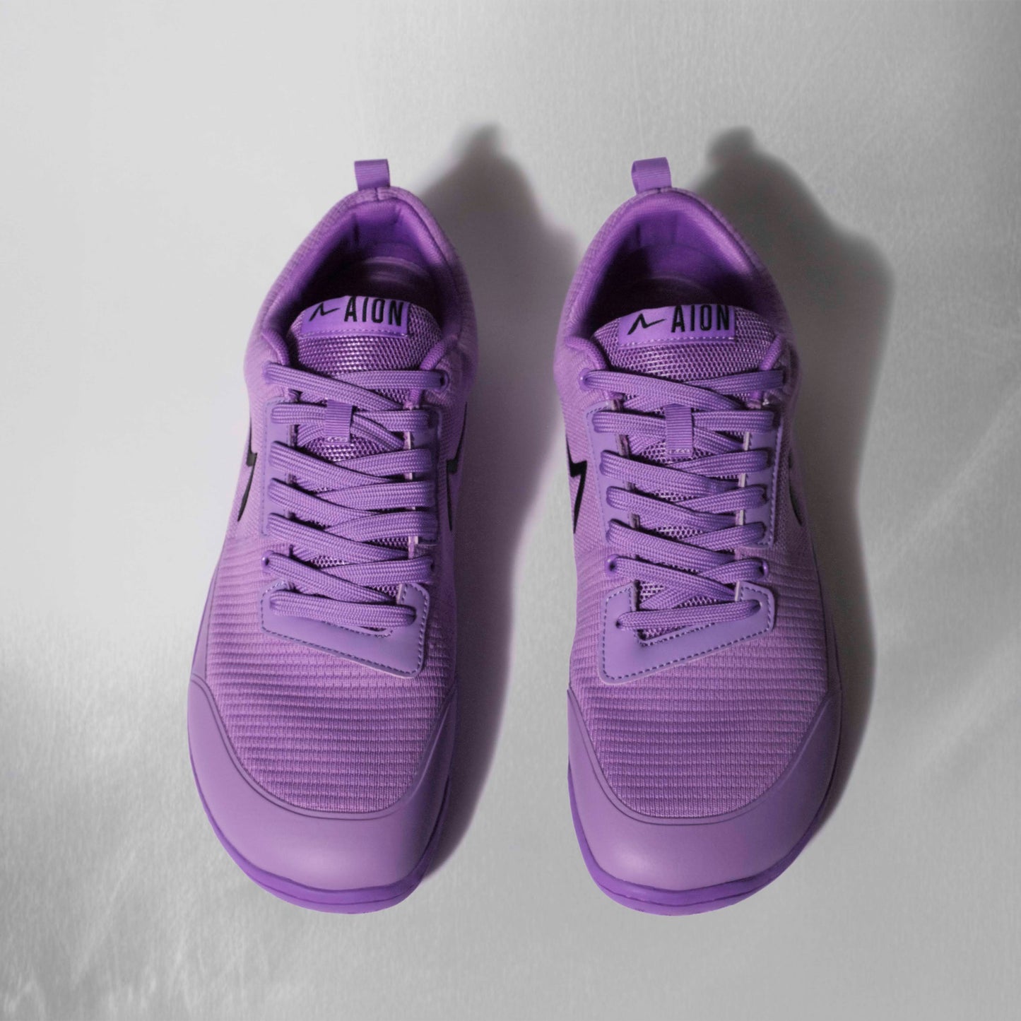 Wide toe box barefoot shoe with a flexible sole to help with strengthening your foot. Training for squats bench deadlifts also is a great powerlifting shoe.