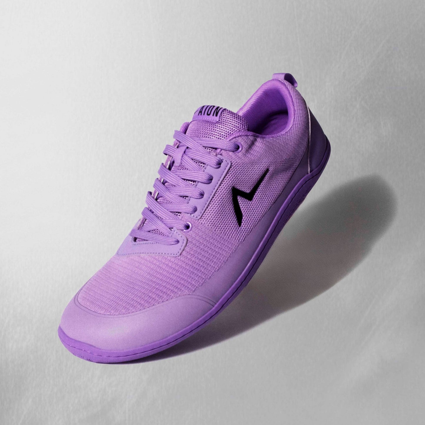 Aion Trainers with reinforced leather lace guard and an ankle and heel cup built for comfort and high performance. Flexible patented sole built for all the highest levels of movements.