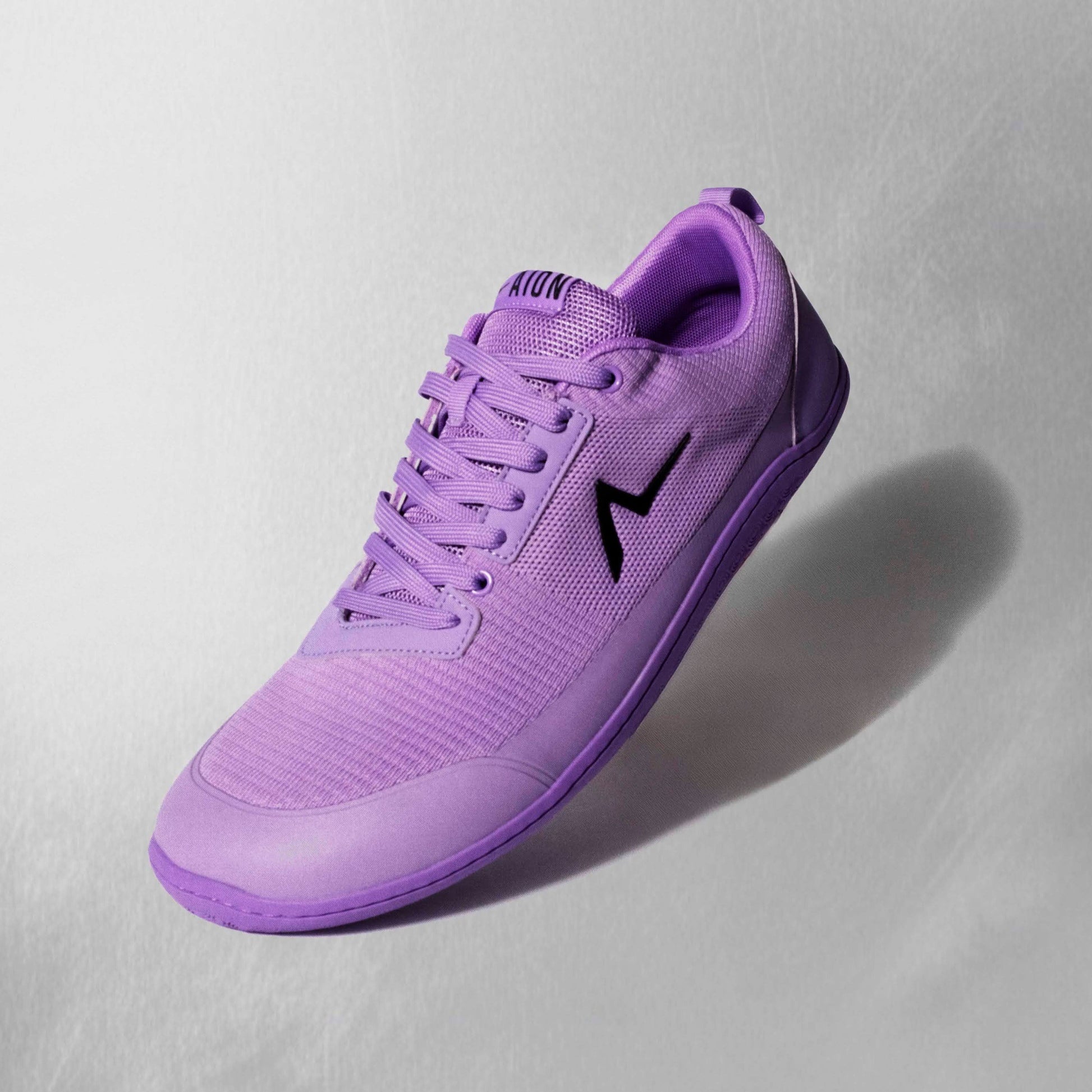 Aion Trainers with reinforced leather lace guard and an ankle and heel cup built for comfort and high performance. Flexible patented sole built for all the highest levels of movements.