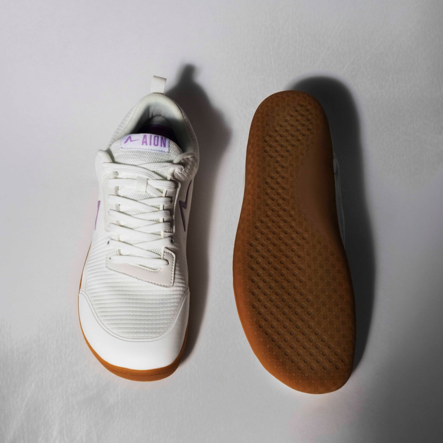 Gum Bottom White Barefoot Shoe Made to be worn casually and for high level training. Minimalist stylish performance lifting. better than vivobarefoot.