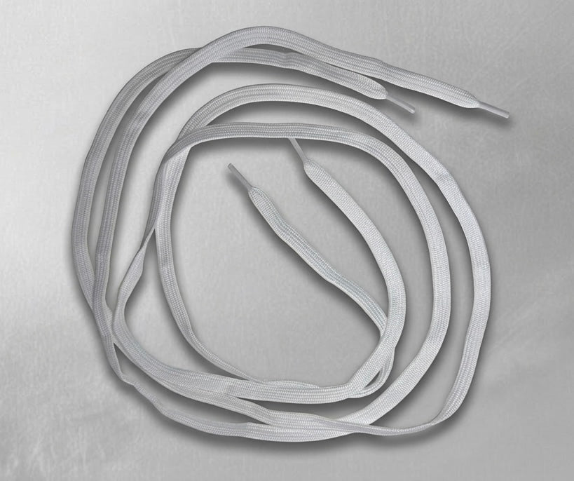 Gray elastic bands arranged in a circular pattern on a gray background